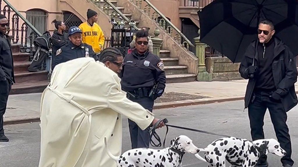 A $ AP Rocky diseret oleh Dalmatians selama pemotretan